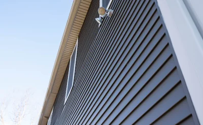siding-on-a-house-with-an-outdoor-light-healthy-homes